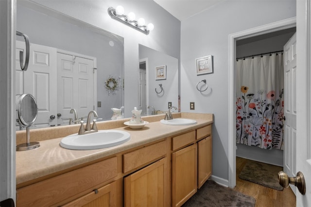 bathroom featuring vanity and hardwood / wood-style floors