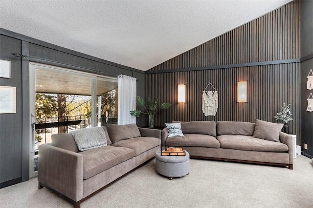 carpeted living room with lofted ceiling and a textured ceiling