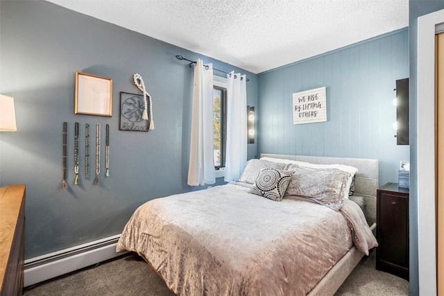 bedroom featuring carpet flooring, a textured ceiling, and baseboard heating