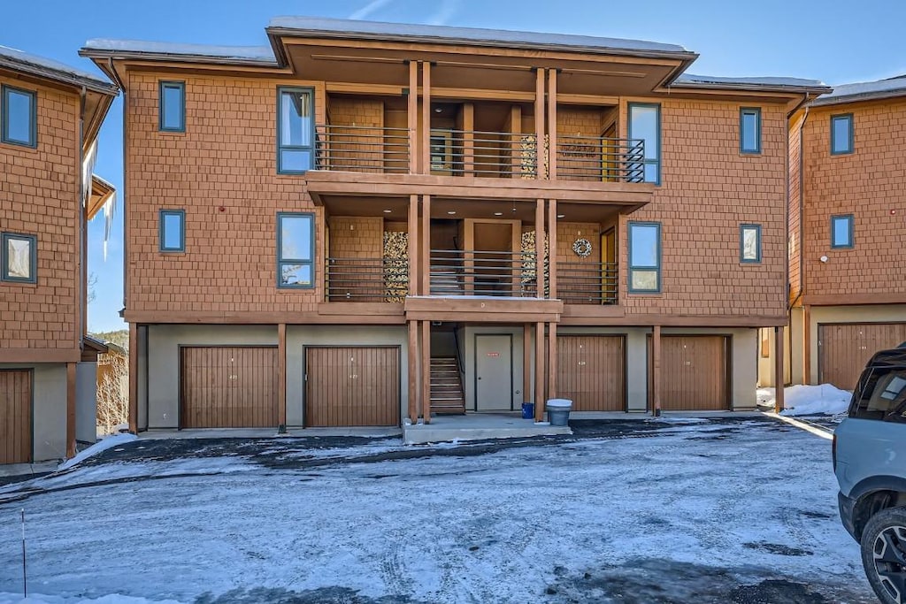 view of front of home with a balcony