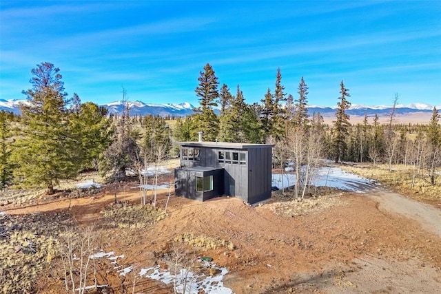 view of outdoor structure with a mountain view