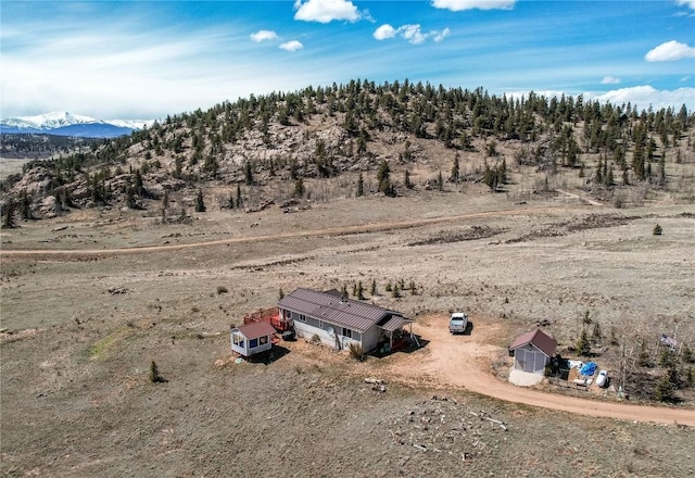 birds eye view of property with a mountain view and a rural view