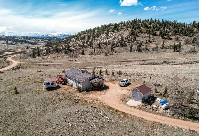 aerial view featuring a mountain view and a rural view