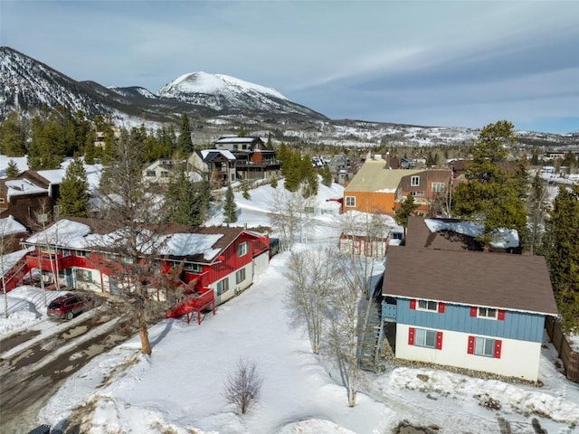 snowy aerial view featuring a mountain view