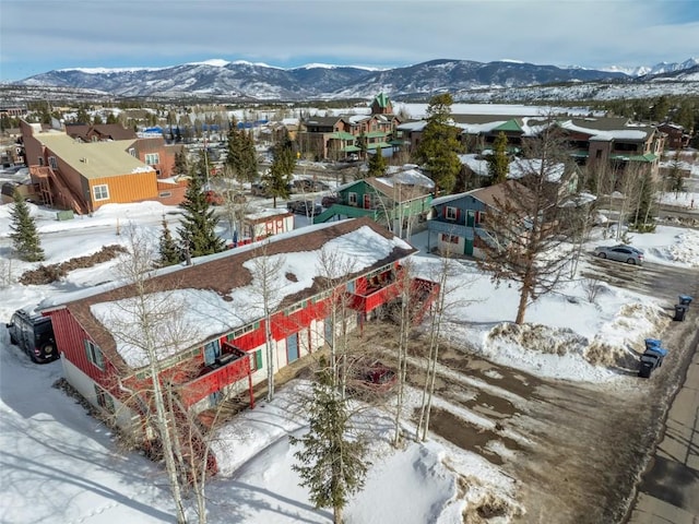 snowy aerial view featuring a mountain view