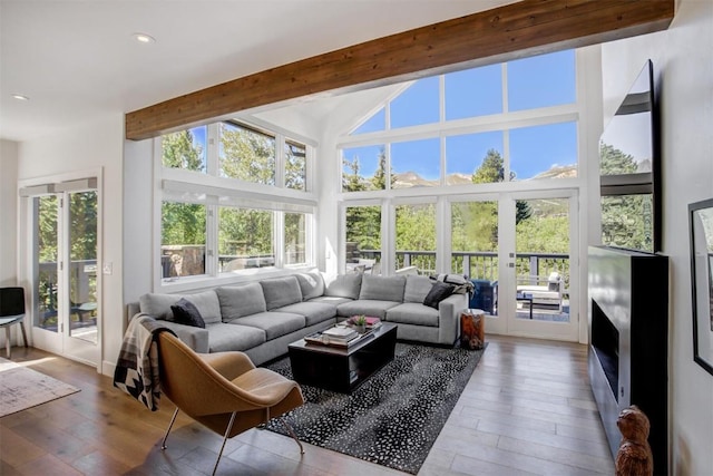 sunroom / solarium with beamed ceiling and french doors