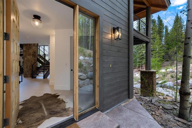 doorway to property featuring a balcony