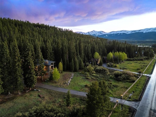 aerial view at dusk featuring a mountain view