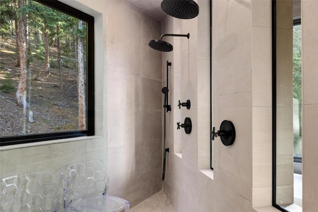 bathroom with tiled shower