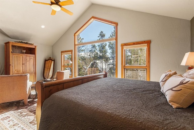 bedroom with a ceiling fan and vaulted ceiling