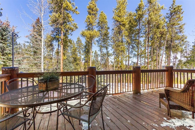 deck featuring outdoor dining area