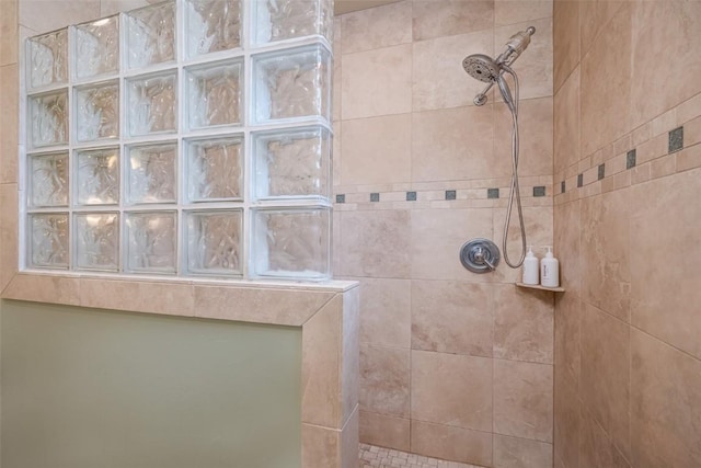 bathroom with tiled shower