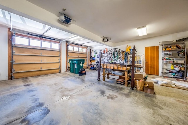 garage featuring a workshop area and a garage door opener