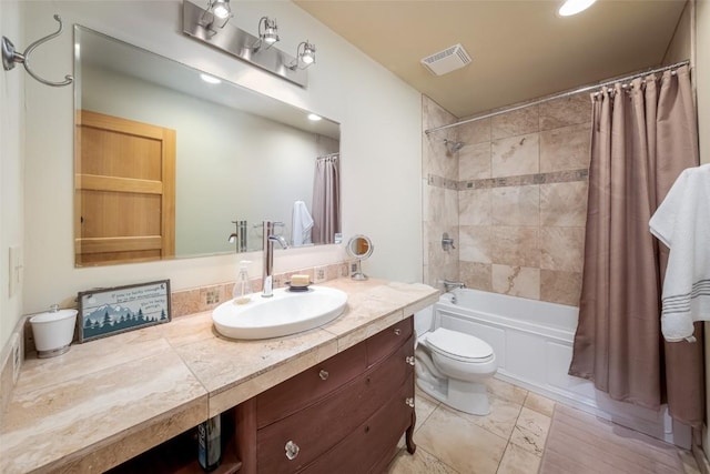 full bathroom with vanity, toilet, and shower / bath combo with shower curtain