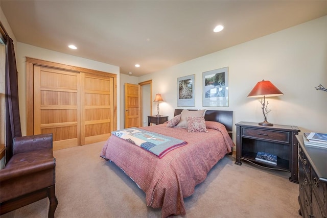 bedroom featuring light colored carpet