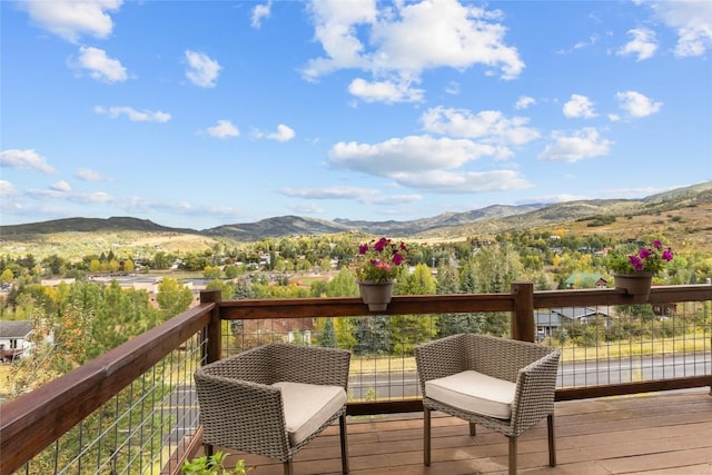 wooden terrace with a mountain view