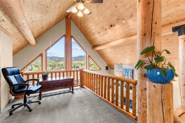 sitting room featuring carpet flooring, beamed ceiling, a mountain view, and wooden ceiling