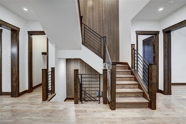 stairway with hardwood / wood-style flooring