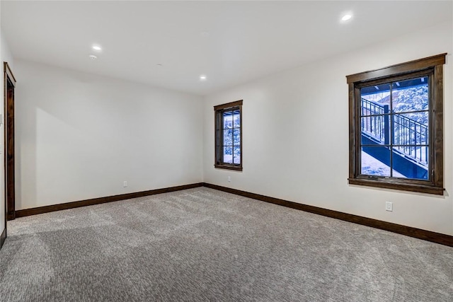 unfurnished room featuring carpet