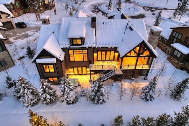 view of snow covered house