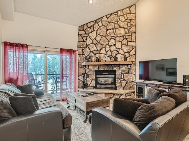 living area with a textured ceiling, high vaulted ceiling, a stone fireplace, and carpet