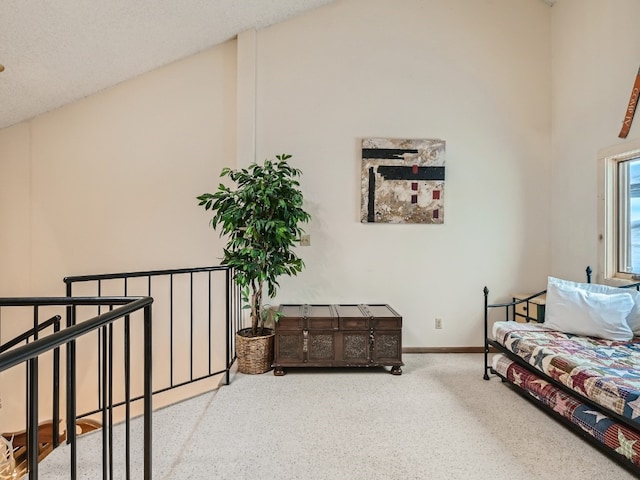 sitting room featuring carpet floors and baseboards