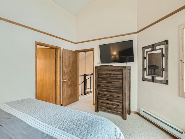 bedroom with a high ceiling, light colored carpet, and baseboard heating