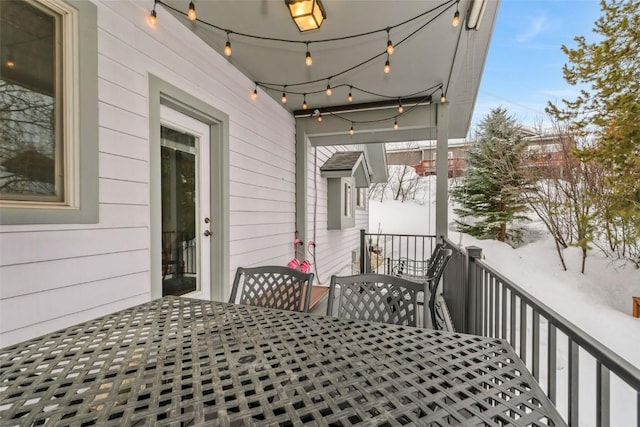 wooden deck featuring outdoor dining area