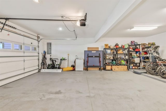 garage with electric panel and a garage door opener