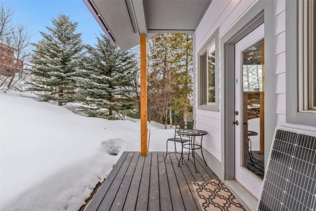 snow covered deck featuring heating unit