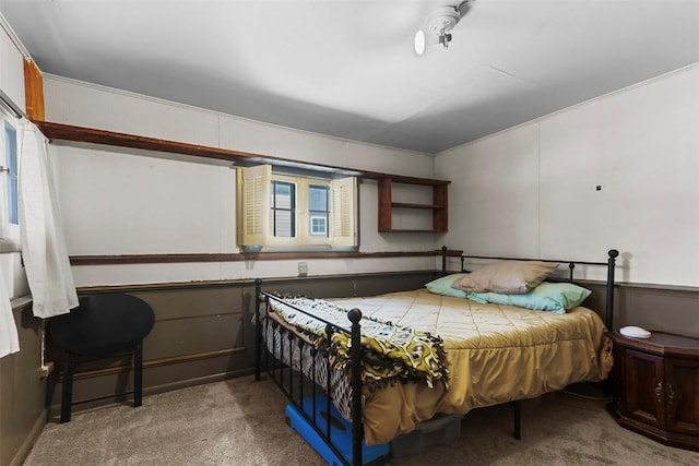 carpeted bedroom featuring multiple windows