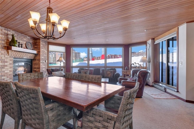 carpeted dining area with wooden ceiling, brick wall, a fireplace, baseboard heating, and a chandelier