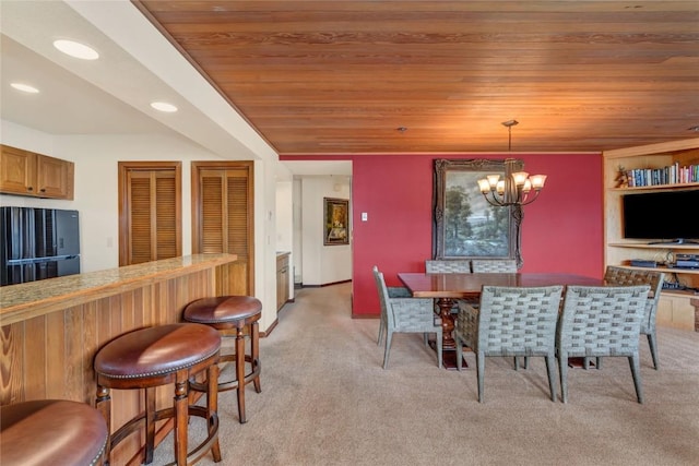 dining room featuring recessed lighting, wooden ceiling, a dry bar, light colored carpet, and a chandelier