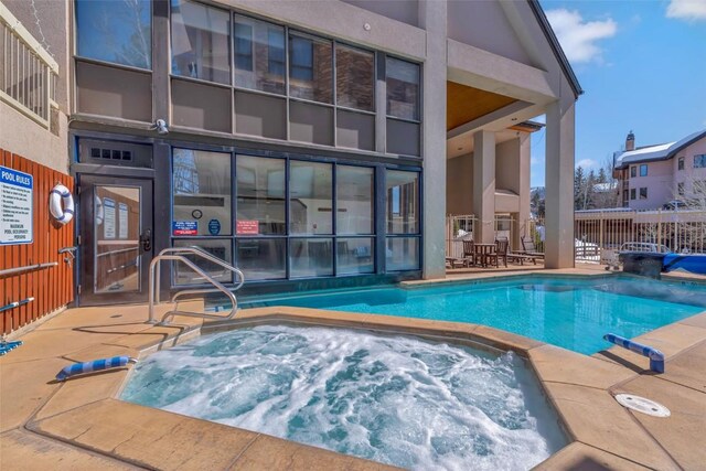 pool with a hot tub