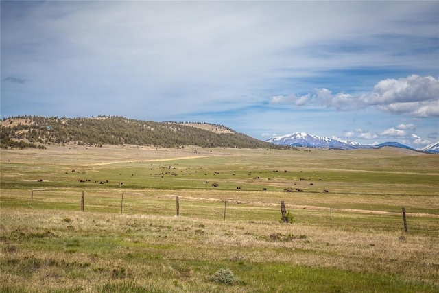 mountain view featuring a rural view