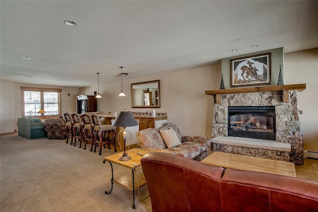 carpeted living area with a fireplace