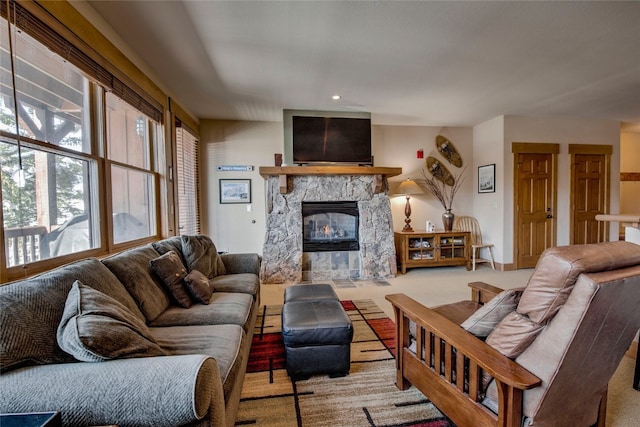 living room featuring a fireplace, carpet flooring, and recessed lighting