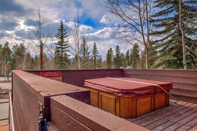 deck featuring a hot tub