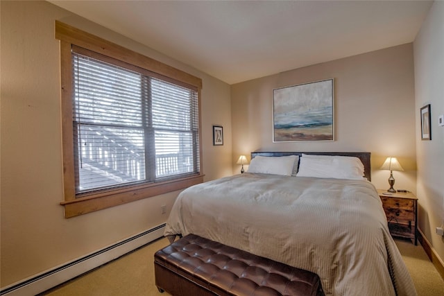 carpeted bedroom with a baseboard heating unit