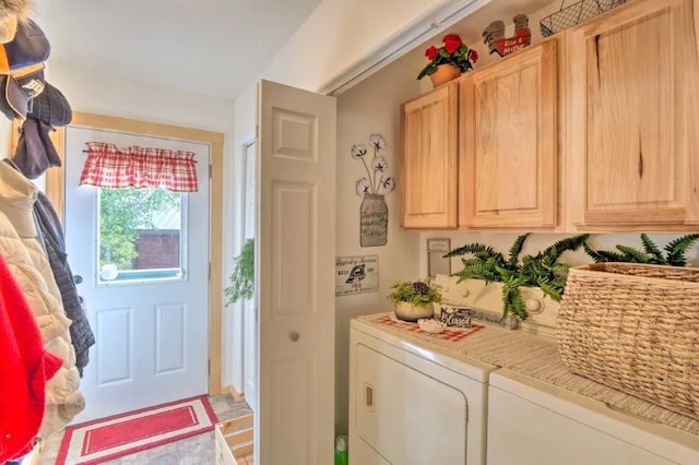 clothes washing area featuring separate washer and dryer