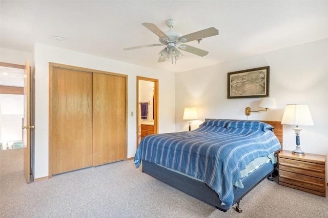 bedroom with carpet, ensuite bathroom, a closet, and ceiling fan