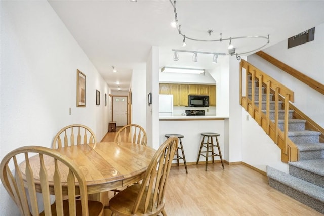 dining room featuring light hardwood / wood-style floors