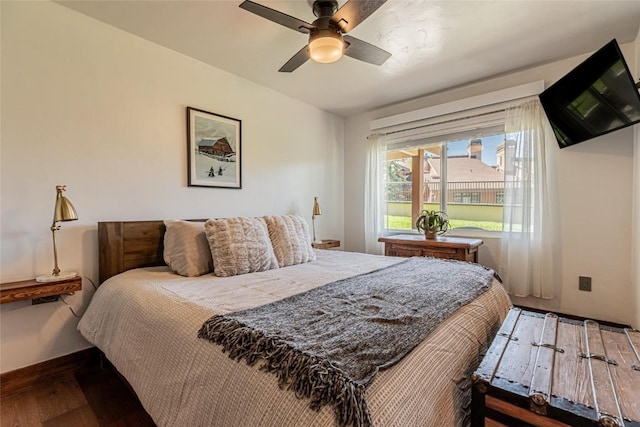 bedroom with hardwood / wood-style floors and ceiling fan