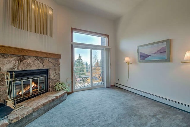 carpeted living room with a baseboard heating unit and a fireplace