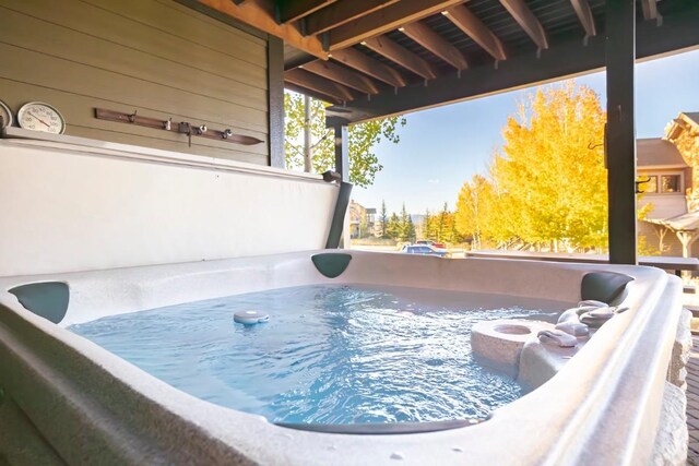 exterior space with a hot tub