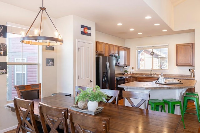 dining area featuring hardwood / wood-style flooring and sink