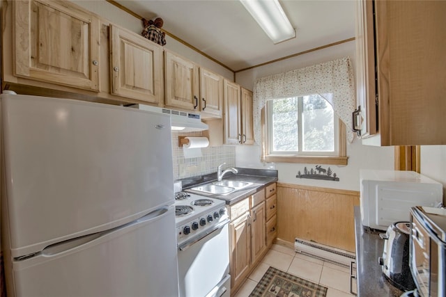 kitchen with white appliances, a baseboard heating unit, sink, light tile patterned floors, and light brown cabinets