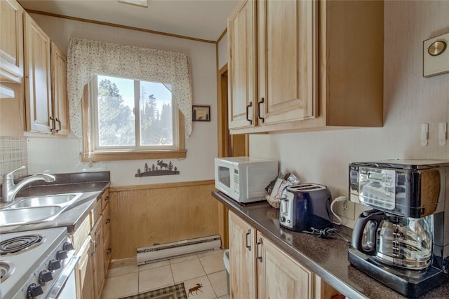 kitchen featuring white appliances, sink, light brown cabinets, a baseboard radiator, and light tile patterned flooring