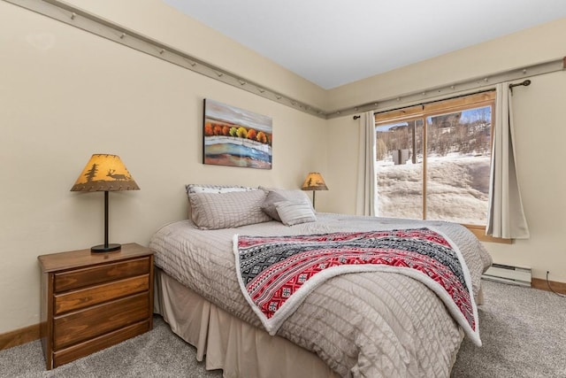 carpeted bedroom featuring baseboards and a baseboard radiator