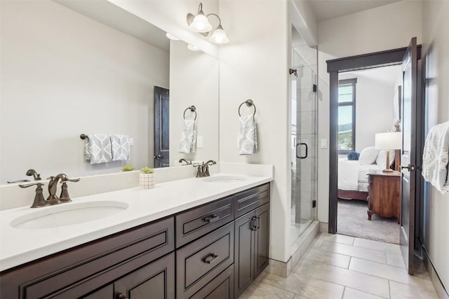 full bath with double vanity, a stall shower, ensuite bath, and a sink